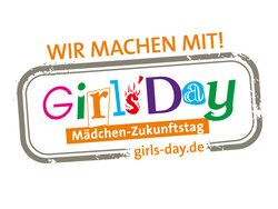 Es handelt sich um ein stempelähnliches Bild mit den folgenden Texten: „Wir machen mit“; “Girls'Day. Mädchen Zukunftstag“; girls-day.de